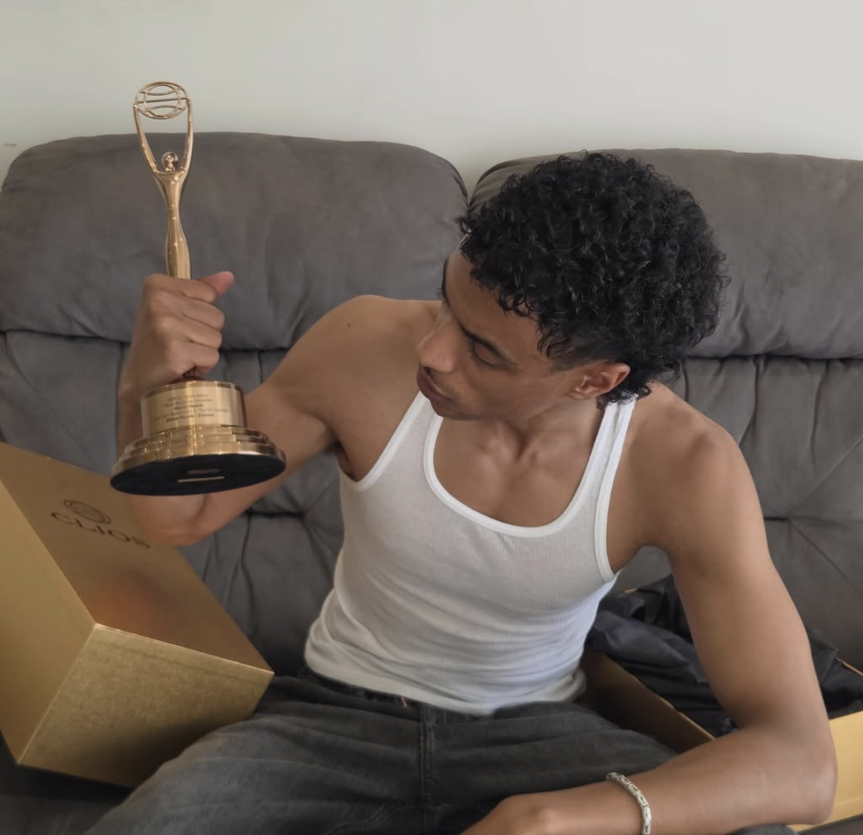 Munzir Mukhtar holding his Clio Award